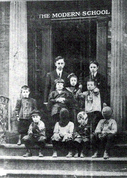 The NYC Modern School, ca. 1911–1912, Principal Will Durant and pupils. This photograph was the cover of the first issue of The Modern School magazine